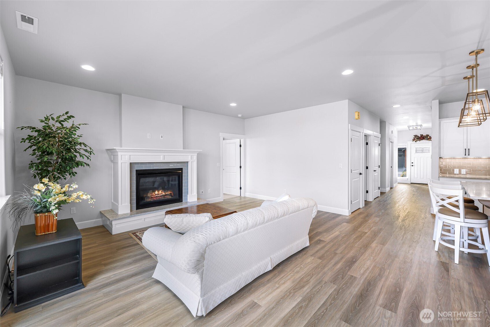 1396 Woods Point Loop Ferndale, WA 98248 - Photo 15 of 32 a living room with furniture and a fireplace