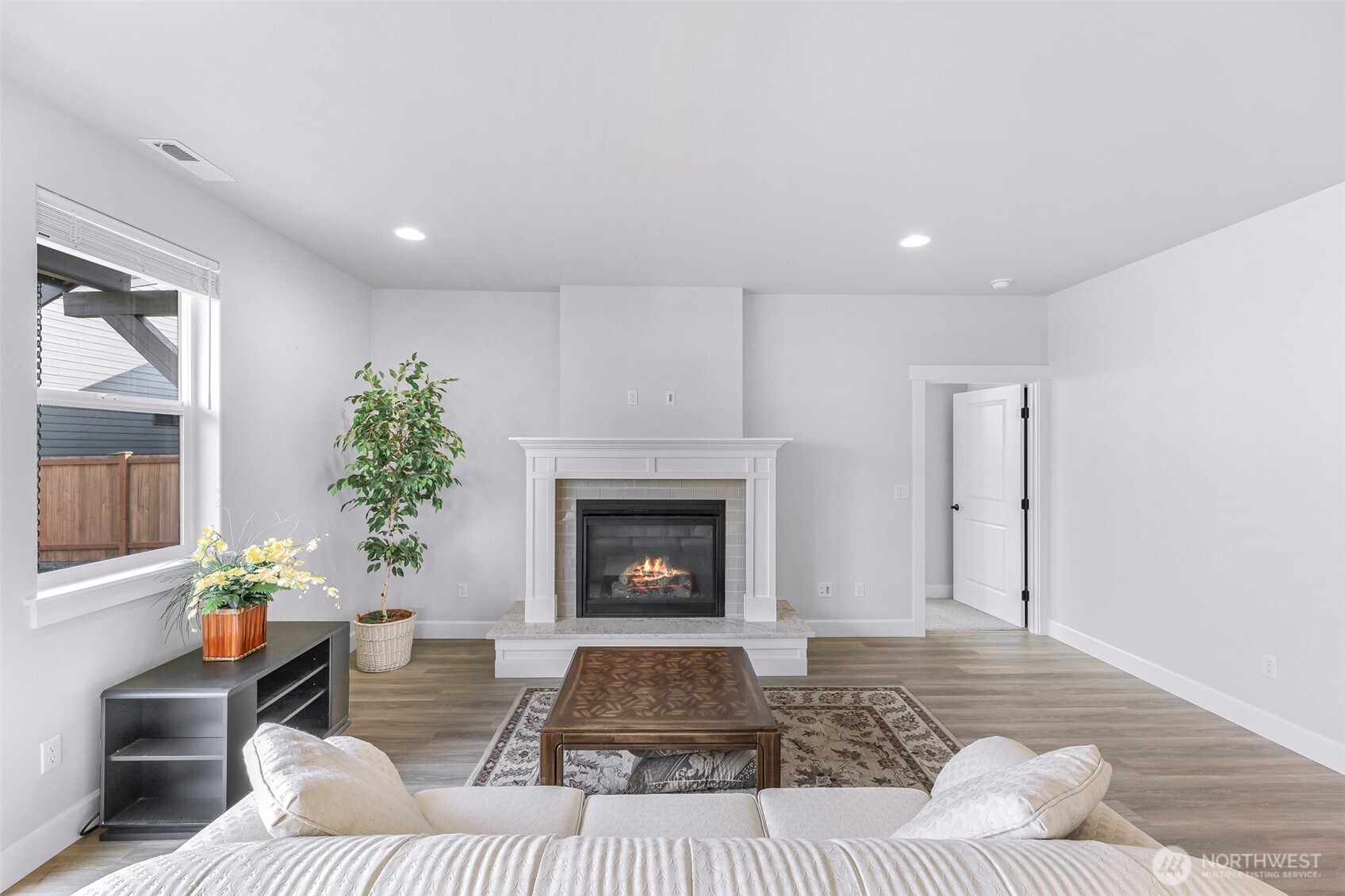 1396 Woods Point Loop Ferndale, WA 98248 - Photo 16 of 32 a living room with furniture and a fireplace