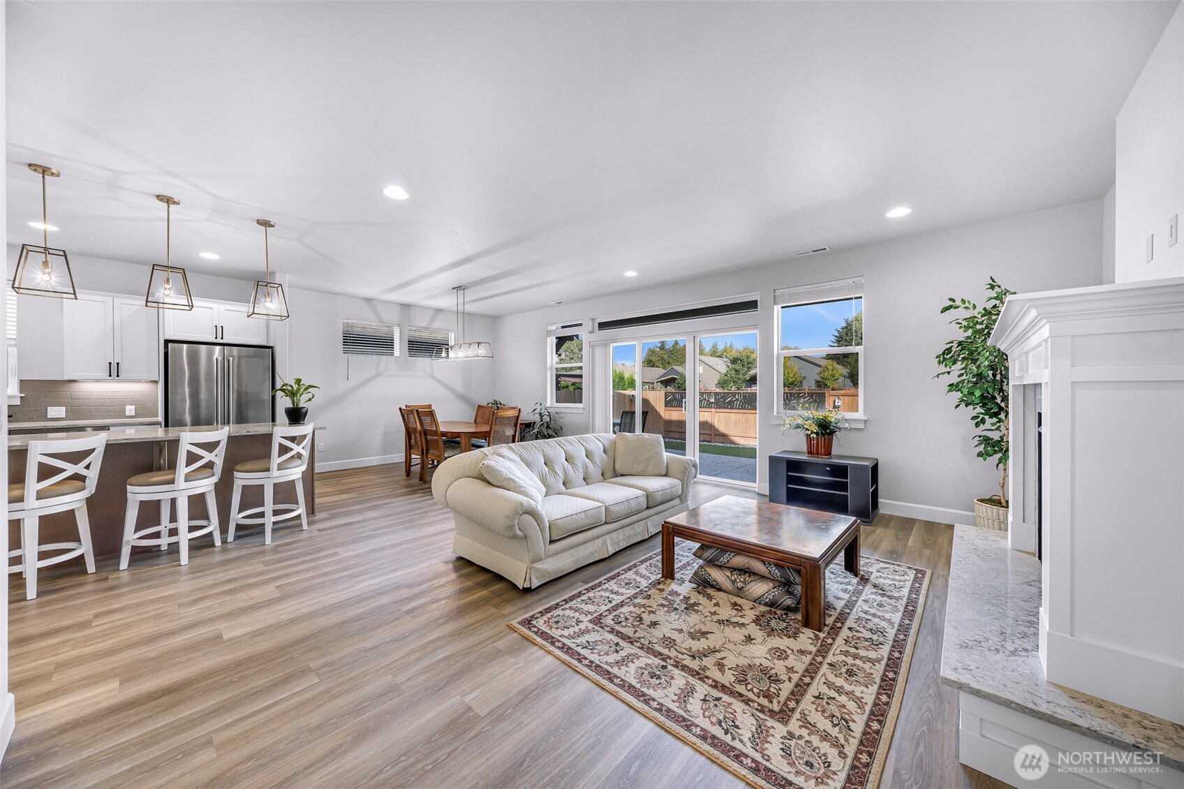 1396 Woods Point Loop Ferndale, WA 98248 - Photo 17 of 32 a living room with furniture and a wooden floor
