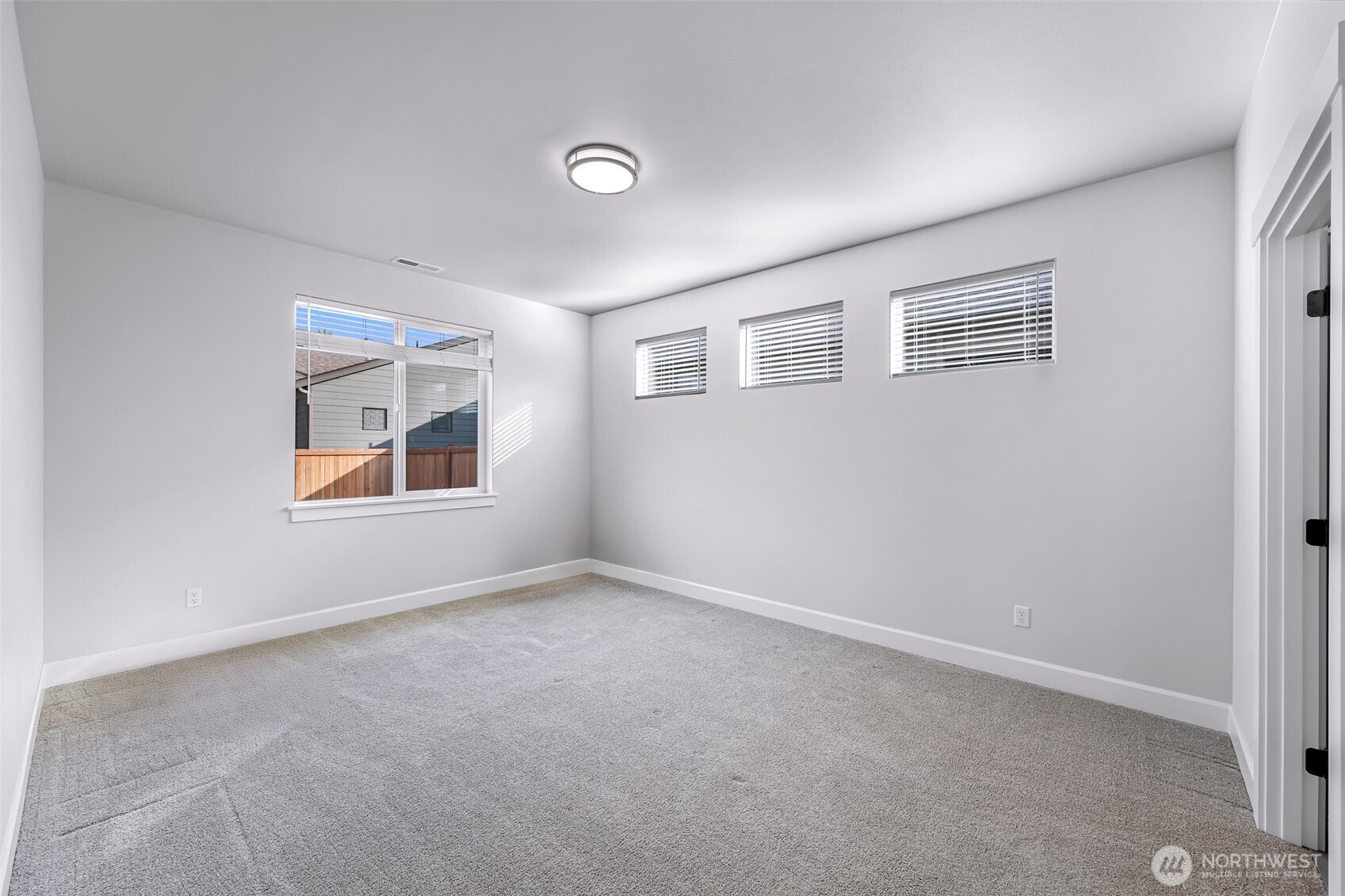 1396 Woods Point Loop Ferndale, WA 98248 - Photo 18 of 32 an empty room with windows and ceiling fan