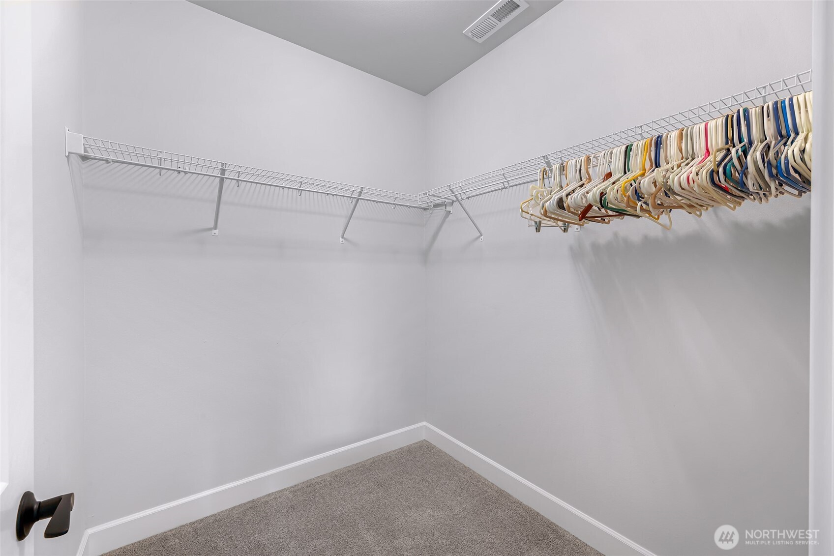 1396 Woods Point Loop Ferndale, WA 98248 - Photo 22 of 32 a view of a room with racks on the wall