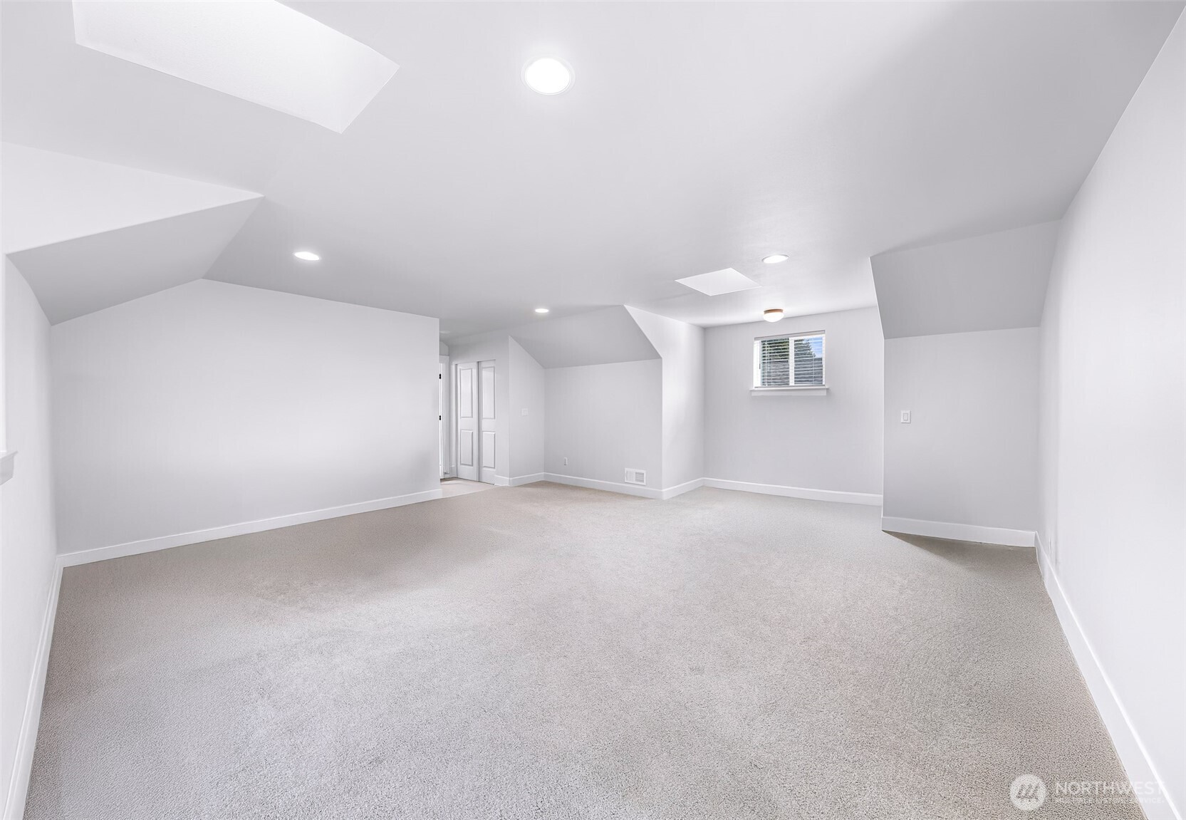 1396 Woods Point Loop Ferndale, WA 98248 - Photo 23 of 32 an empty room with a kitchen and a sink