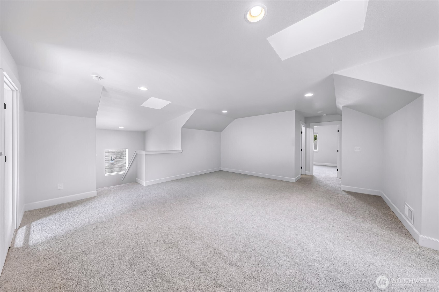 1396 Woods Point Loop Ferndale, WA 98248 - Photo 24 of 32 an empty room with a kitchen and a sink