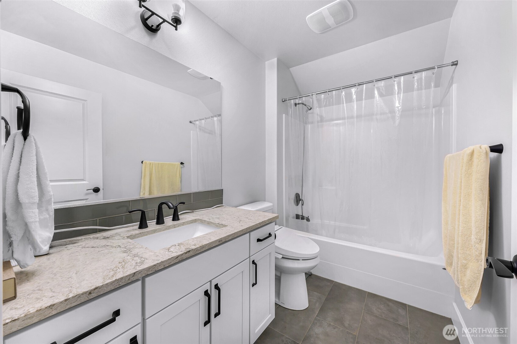 1396 Woods Point Loop Ferndale, WA 98248 - Photo 27 of 32 a bathroom with a granite countertop sink toilet and shower