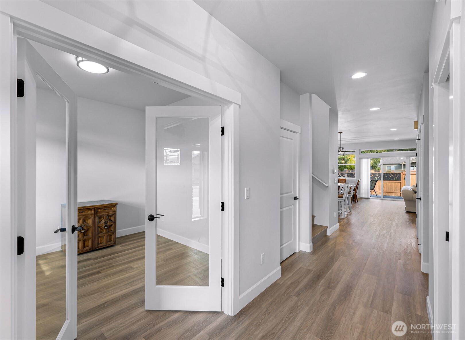 1396 Woods Point Loop Ferndale, WA 98248 - Photo 3 of 32 a view of a hallway view with wooden floor and living room