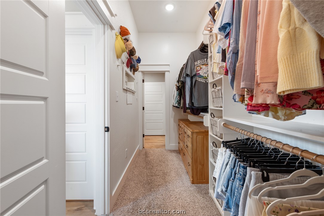 244 Brazos Bend Snook, TX 77879 - Photo 21 of 33 a view of walk in closet with clothes and shoes