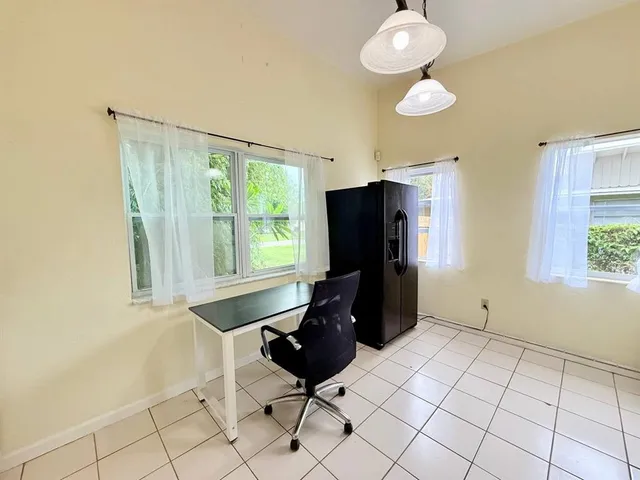 a room with cabinets and window