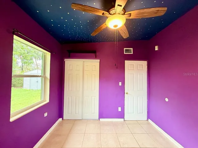 a view of a livingroom with a swimming pool