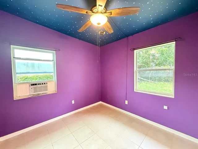 a view of workspace with a window and a ceiling fan