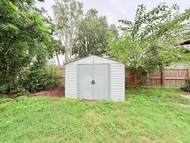 a backyard of a house with lots of green space