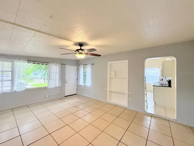a view of an empty room with a window