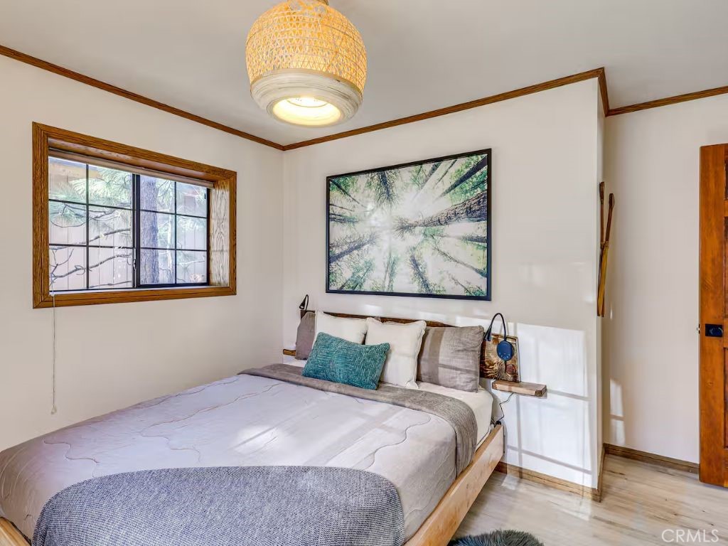 452 Orange Sugarloaf, CA 92386 - Photo 15 of 29 a bedroom with a bed and a painting on the wall