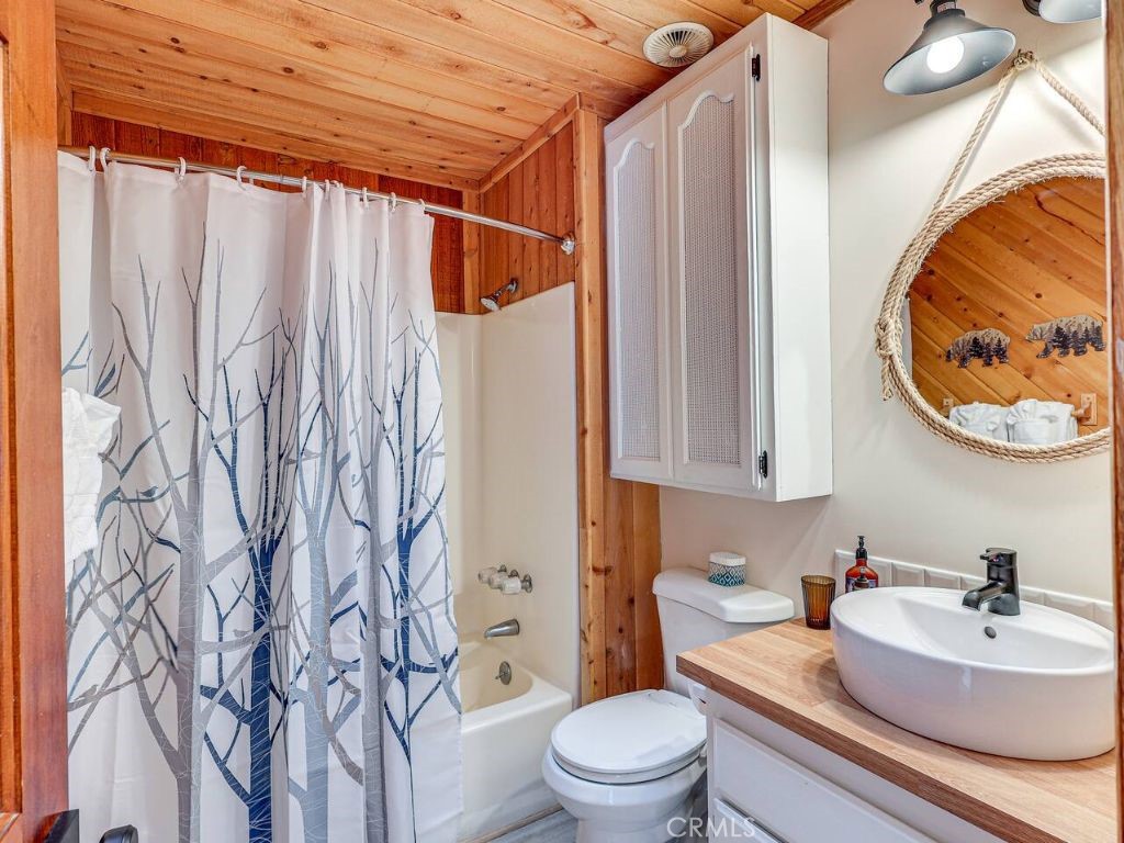 452 Orange Sugarloaf, CA 92386 - Photo 17 of 29 a bathroom with a sink toilet and shower