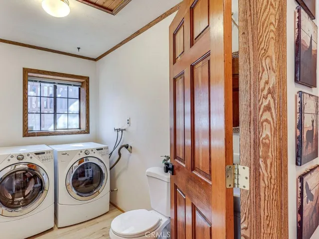 a view of a hallway with washer and dryer