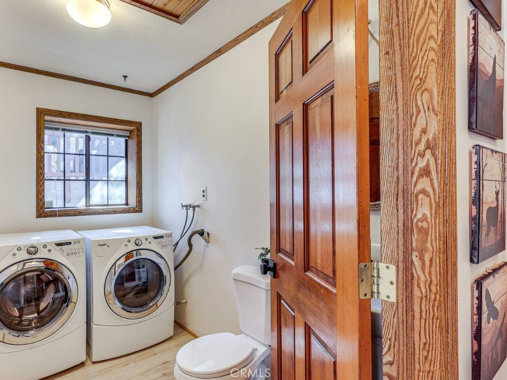 452 Orange Sugarloaf, CA 92386 - Photo 20 of 29 a view of a hallway with washer and dryer