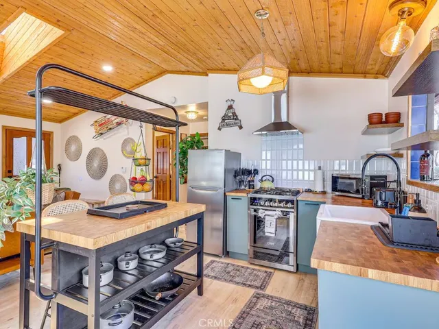 a kitchen with stainless steel appliances granite countertop a stove and a sink