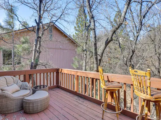 a view of balcony with furniture