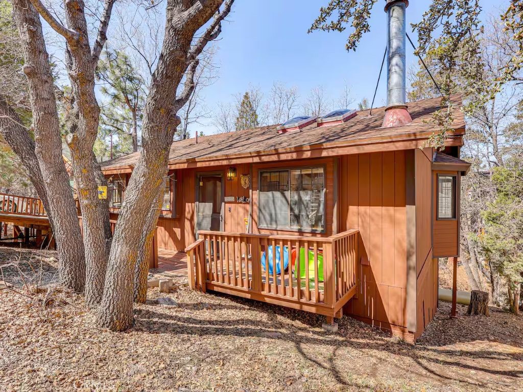 452 Orange Sugarloaf, CA 92386 - Photo 25 of 29 a view of a house with a wooden deck next to a road