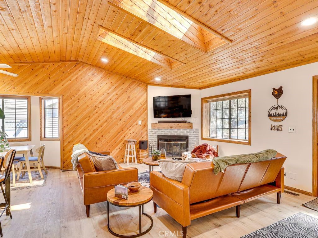 452 Orange Sugarloaf, CA 92386 - Photo 4 of 29 a living room with furniture a flat screen tv and a table