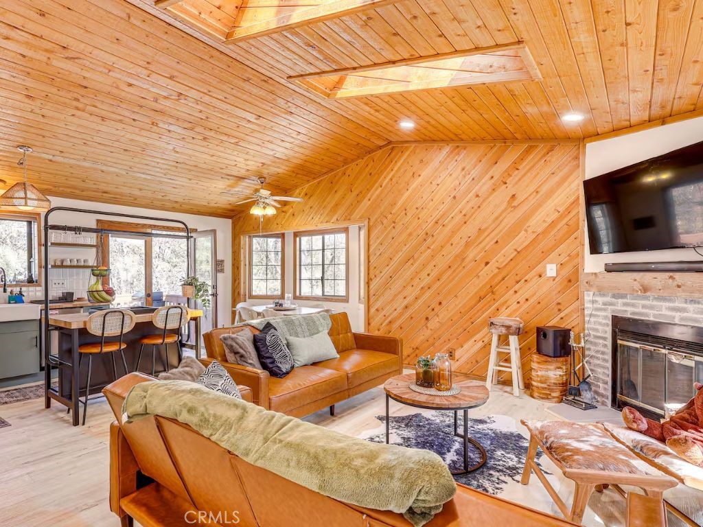 452 Orange Sugarloaf, CA 92386 - Photo 5 of 29 a living room with fireplace furniture and a flat screen tv