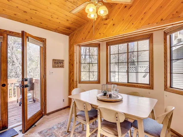 a view of a dining room with furniture and window