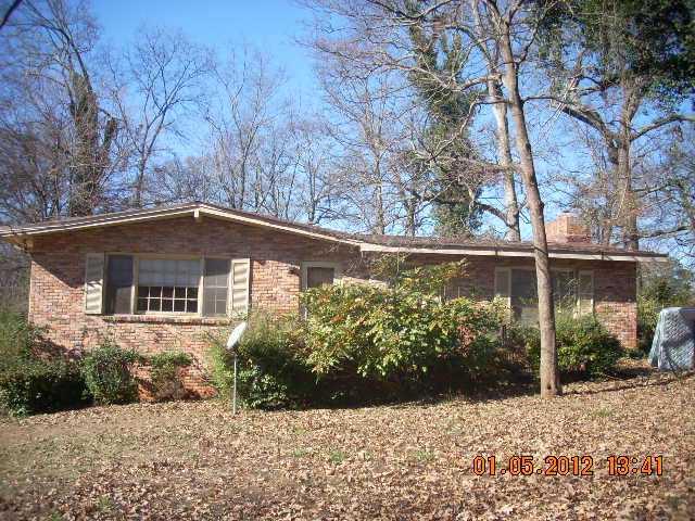 1991 Stanton Street Decatur, GA 30032 - Photo 1 of 1 a front view of a house with a yard and garage