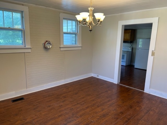301 Bennett Street Decherd, TN 37324 - Photo 11 of 41 a view of empty room with wooden floor and fan