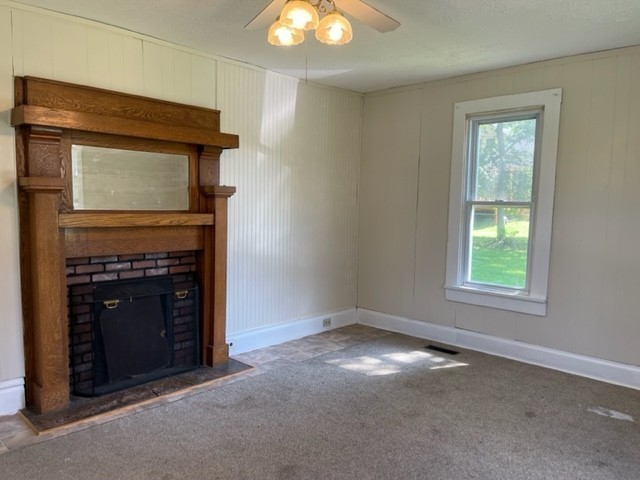 301 Bennett Street Decherd, TN 37324 - Photo 12 of 41 an empty room with windows and fireplace
