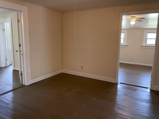 301 Bennett Street Decherd, TN 37324 - Photo 17 of 35 a view of an empty room with wooden floor and a window