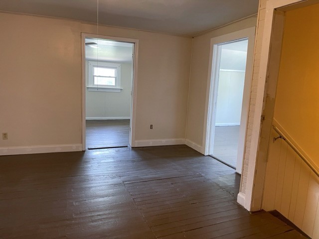 301 Bennett Street Decherd, TN 37324 - Photo 18 of 35 an empty room with wooden floor and windows