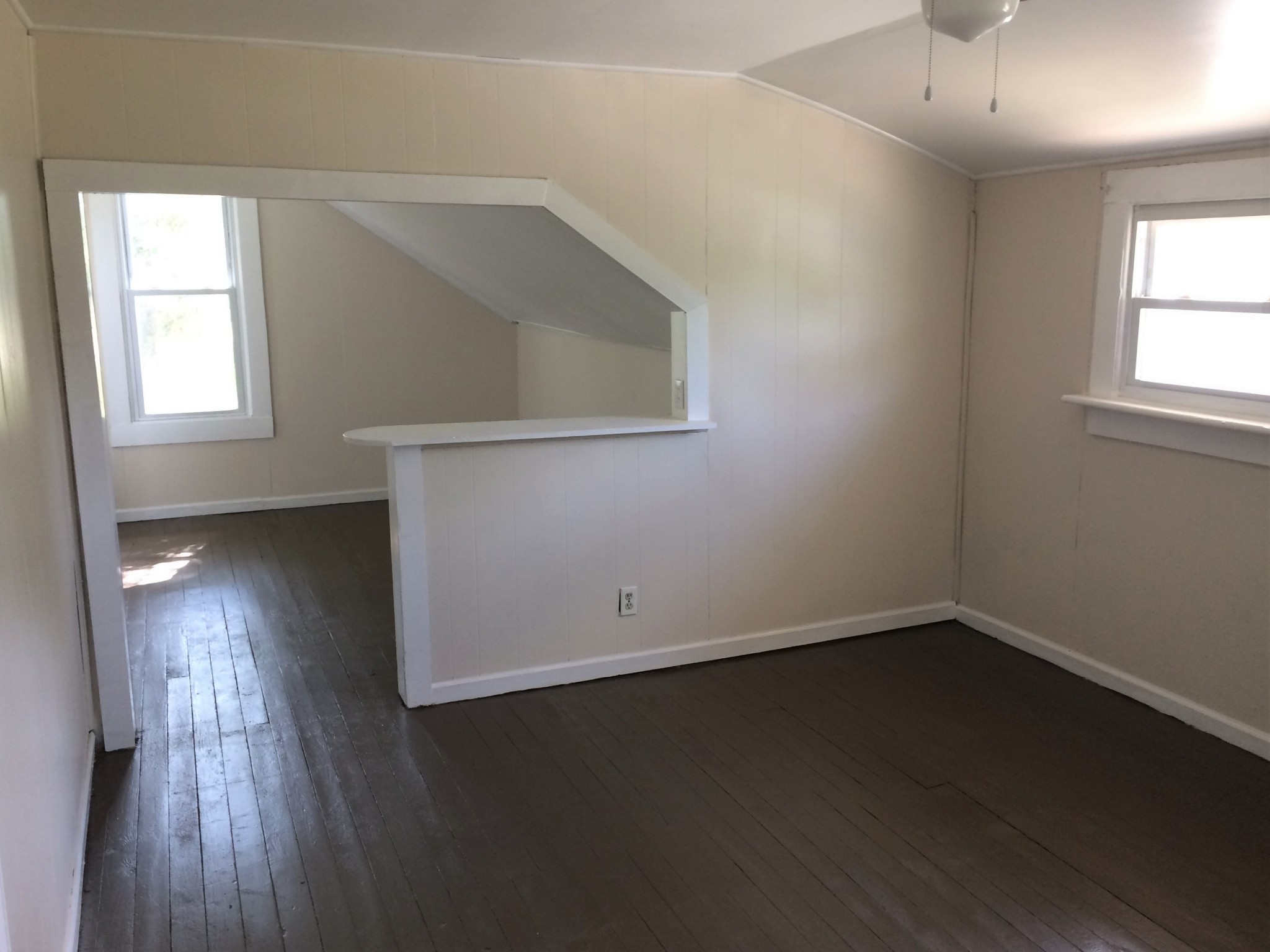 301 Bennett Street Decherd, TN 37324 - Photo 22 of 35 an empty room with wooden floor and windows