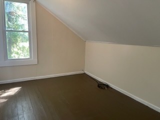 301 Bennett Street Decherd, TN 37324 - Photo 28 of 41 an empty room with wooden floor and windows
