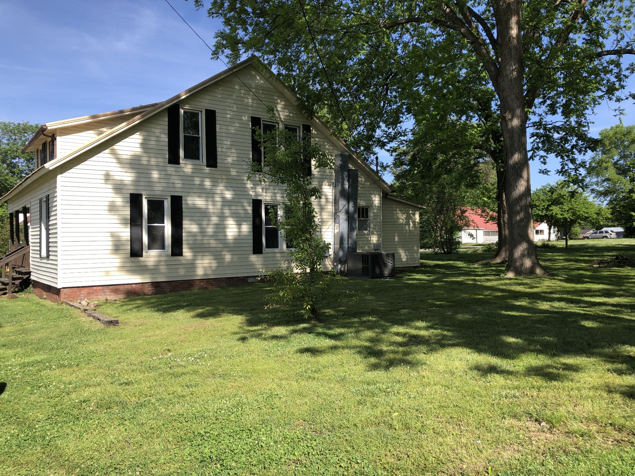 301 Bennett Street Decherd, TN 37324 - Photo 3 of 41 a front view of a house with a yard