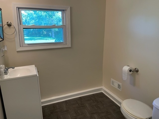 301 Bennett Street Decherd, TN 37324 - Photo 31 of 41 a bathroom with a granite countertop toilet and a sink
