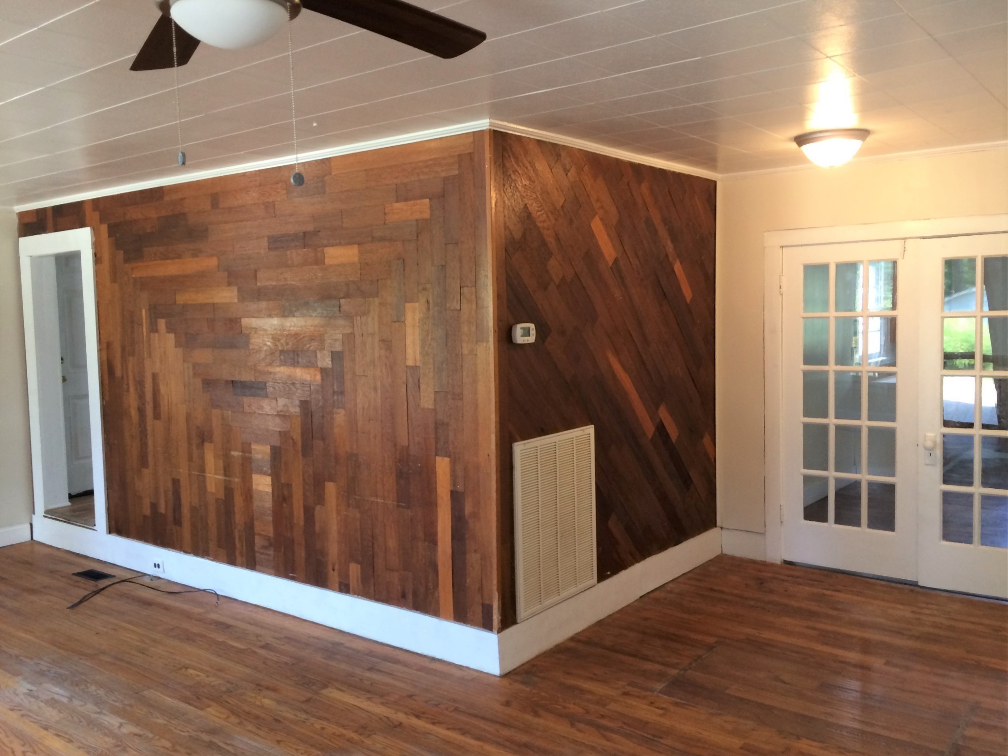 301 Bennett Street Decherd, TN 37324 - Photo 7 of 41 an empty room with wooden floor and windows