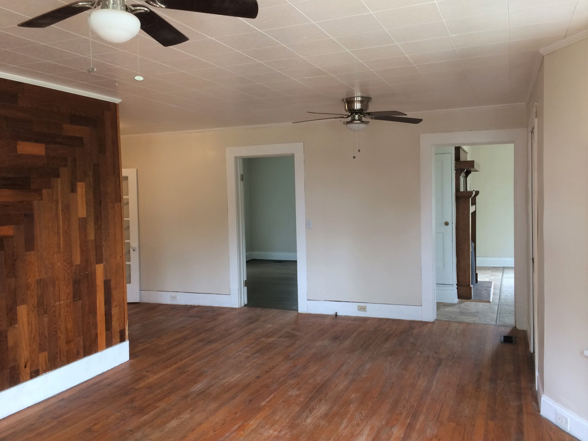 301 Bennett Street Decherd, TN 37324 - Photo 8 of 41 an empty room with wooden floor closet and windows