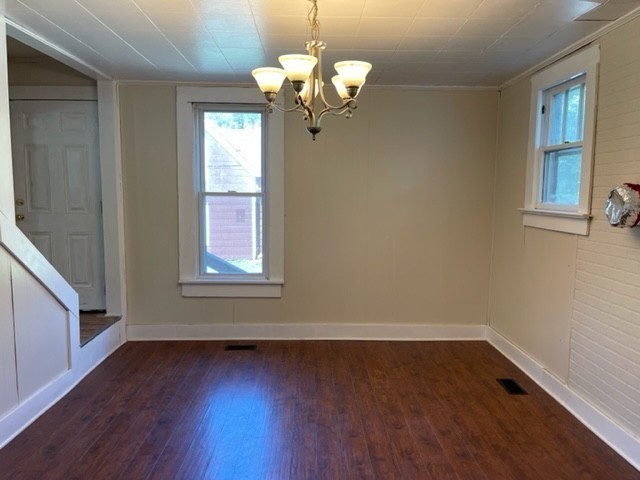 301 Bennett Street Decherd, TN 37324 - Photo 10 of 41 a view of a room with wooden floor and chandelier
