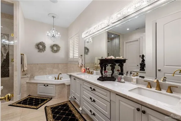 a bathroom with a sink double vanity and a mirror