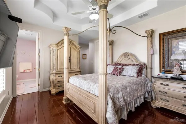 a bathroom with a sink vanity mirror and toilet