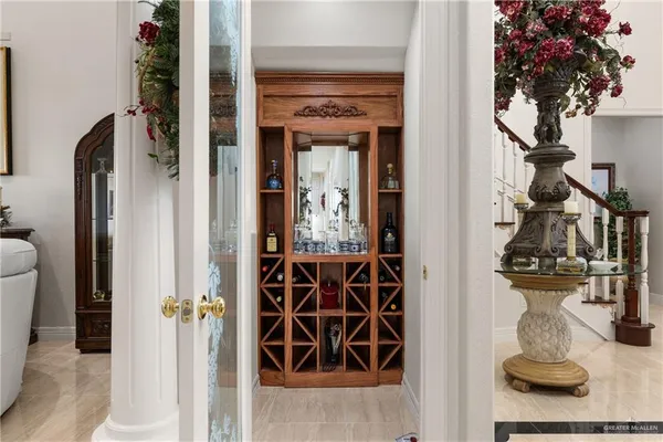 a view of a hallway with a flower pot