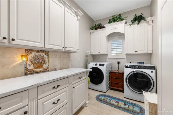 a vase of flowers sitting on a table with chairs