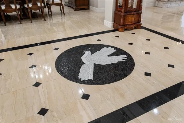 a view of a house with a big yard and large trees