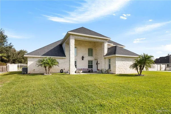 an aerial view of a house with a ocean view