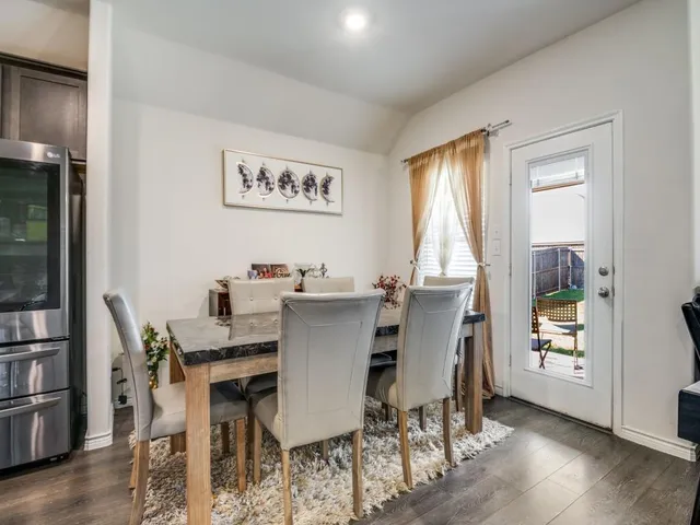 a kitchen with stainless steel appliances a stove microwave and a refrigerator