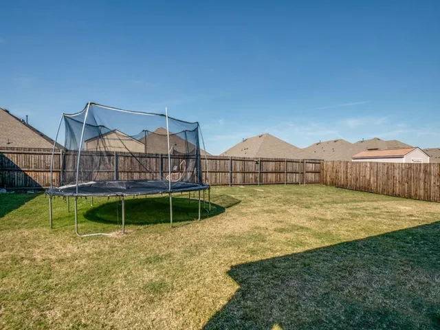 a bathroom with a sink a toilet and shower curtain