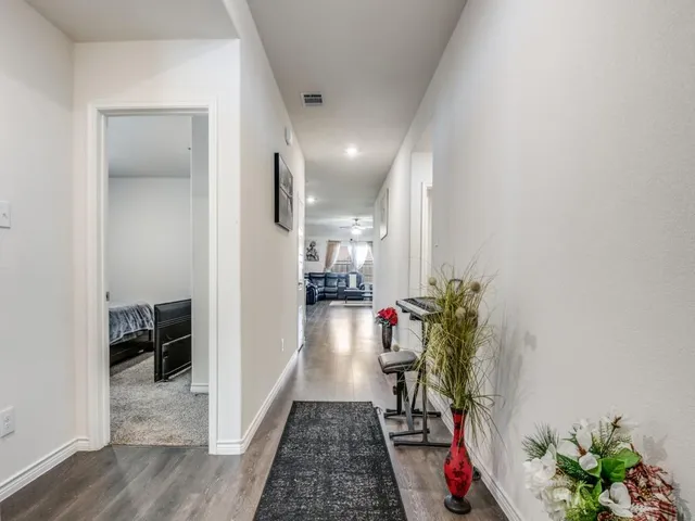 a room with furniture and a potted plant