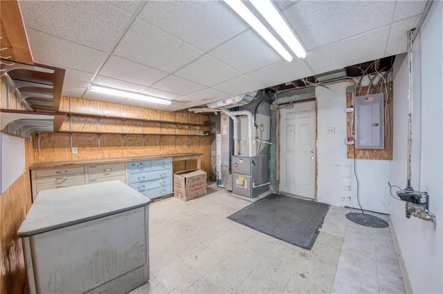 a view of empty room with wooden ceiling