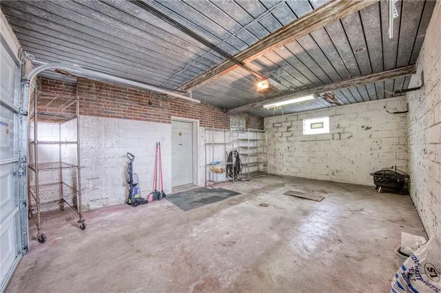 a view of house with backyard and a garden