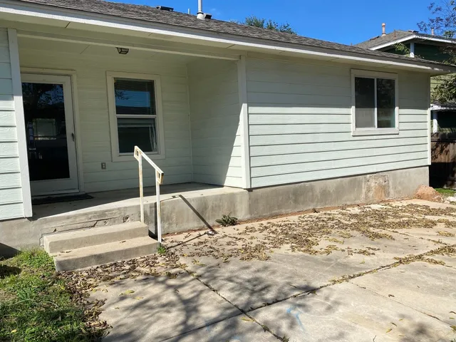 a view of a backyard of a house