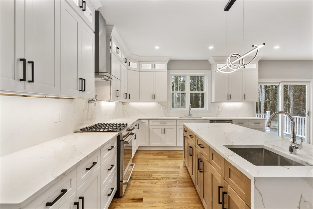 102 Pine Street Norton, MA 02766 - Photo 11 of 41 a kitchen with stainless steel appliances granite countertop a sink and cabinets